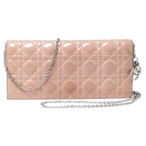 dior beige clutch|Dior metal clutch.